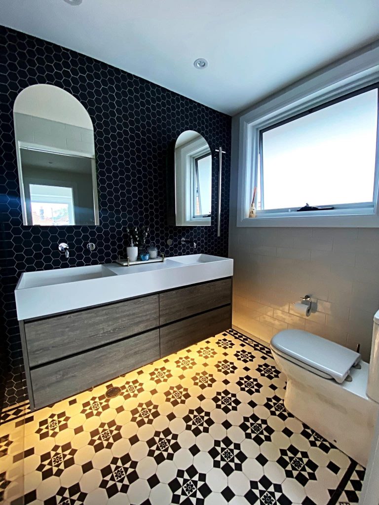 Bathroom renovation with timber vanity and tessellated floor tiles in Birchgrove