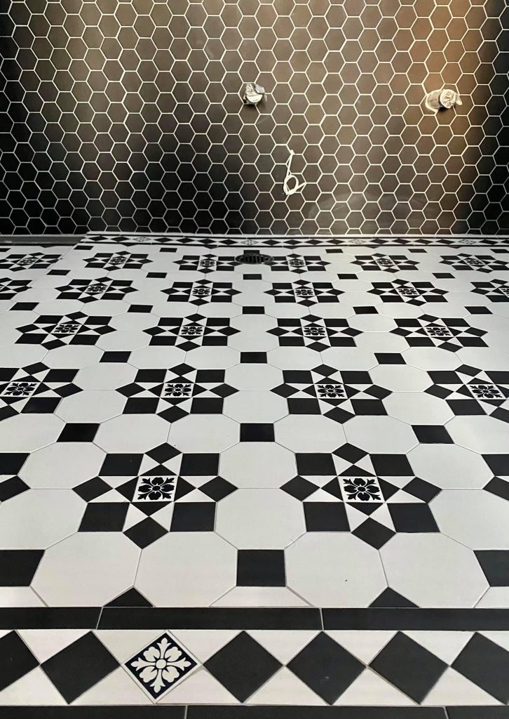 Black and white tessellated bathroom floor tiling in Sydney Inner West