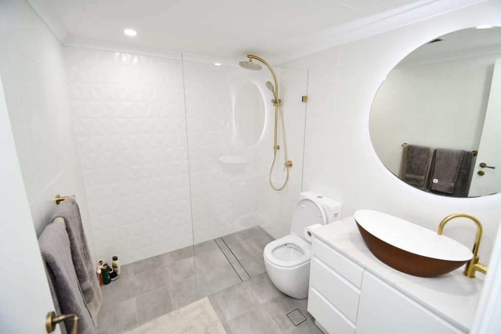 Contemporary white bathroom renovation in Sydney CBD